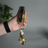 Galaxy Z Flip 7 Luxury Spinning Dollar Bling Case | Crystal Clear Cover with Pearl Strap